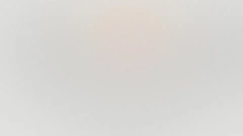 Subtle beige and light brown grainy texture with soft circular gradients. Vídeo Stock 309855790