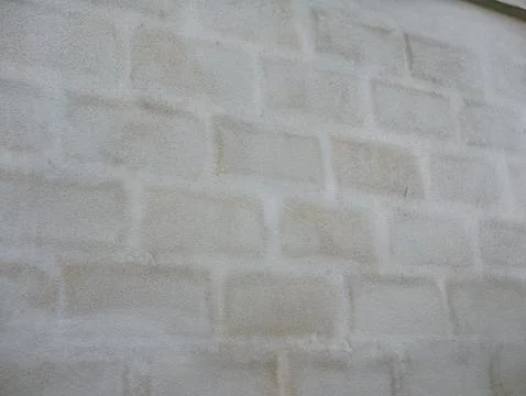 Subtle block pattern showing through light grey plastered wall, minimalist .. 写真素材