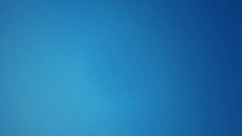 A subtle blue color gradient shifts gently in a seamless loop Stock Footage 340957061