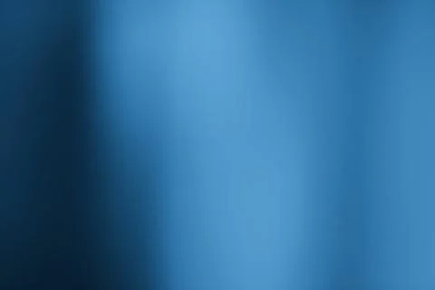 Subtle blue gradient backdrop with soft shadow for backgrounds Foto stock