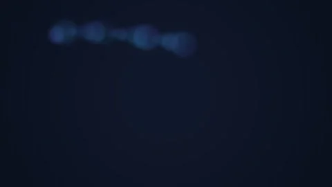 A subtle blue light flare glowing against a deep dark background texture Stock Footage 339616471