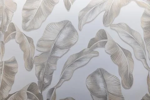 Subtle botanical leaf pattern on light grey wallcovering 스톡 사진