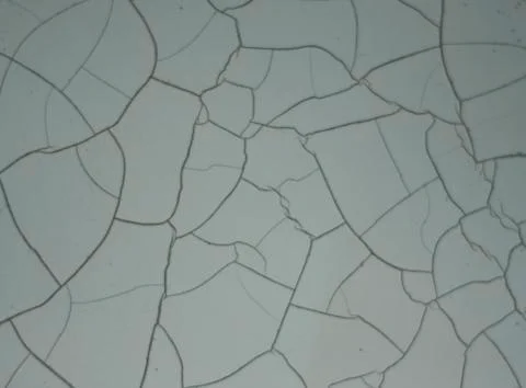 Subtle cracked paint pattern on white wall with hidden number Stockfoto's