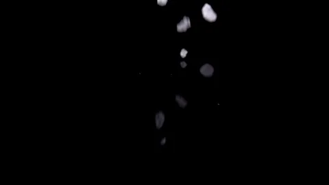 Subtle crystal meth bath salt slow motion drop on reflective black Stock Footage 87237042