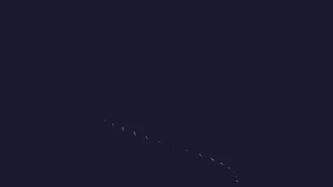 A subtle curve of glowing white light particles against a deep dark background Video stock 335117331