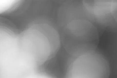 Subtle dance of grayscale bokeh lights creating a dreamy atmosphere Stock Photos