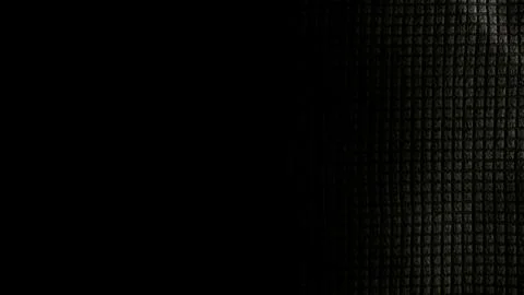 Subtle dark grid pattern emerges in minimalist abstract texture with deep bla Stock Photos