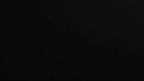Subtle dark particles floating slowly in a deep black empty space Vídeos de archivo 333212880