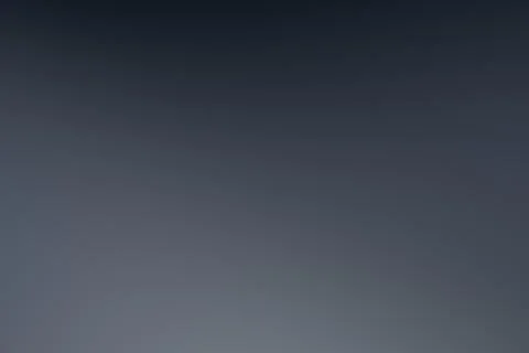 A subtle dark slate blue gradient fills the frame with softly changing tone.. Illustrazione stock