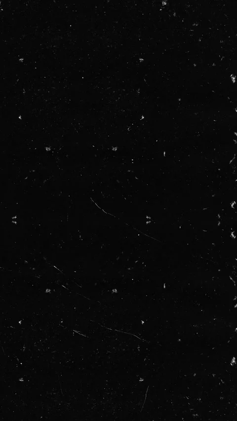 Subtle dust and grain texture overlay on black background for clean transitions Stock Footage 326168016