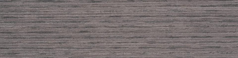 Subtle elegance in slate grey tones on a seamless ash wood veneer surface Stock Photos