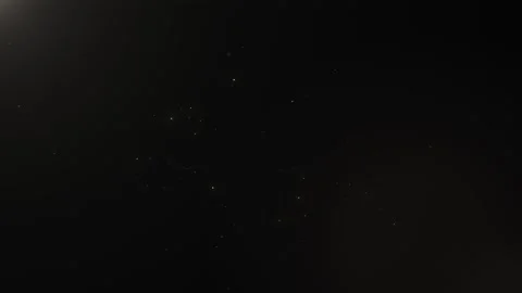 Subtle floating dust particles on a dark background Stock Footage 328448972