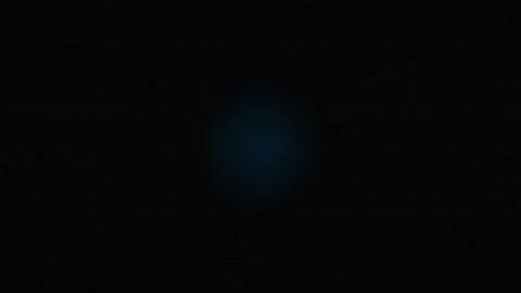A subtle glowing blue point of light centered against a deep black background Video stock 339617621