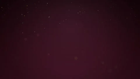 Subtle Glowing Dust Particles Floating in Dark Red Background Video stock 347966935