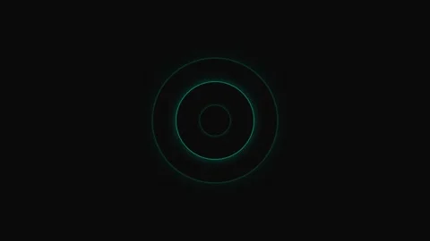 A subtle glowing green circle centered against a deep black background Video stock 339615342