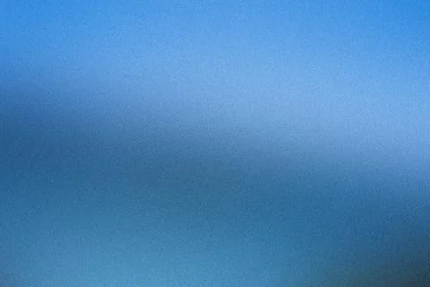 Subtle gradient on abstract blue background with fine grain texture Stock Photos