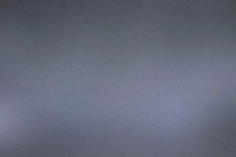 Subtle gradient lighting over a dark grey textured background Stock Photos