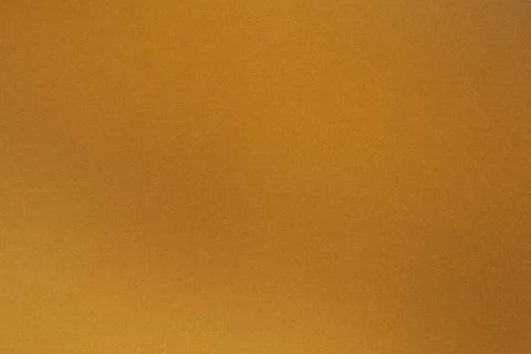 Subtle grainy texture on a simple gold gradient background Foto stock