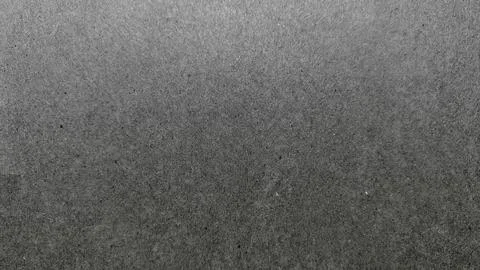 Subtle gray gradient texture on speckled concrete surface capturing minimalis Stock Photos