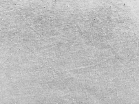 Subtle light gray cotton fabric texture with diagonal wrinkle ideal for minim Stock Photos