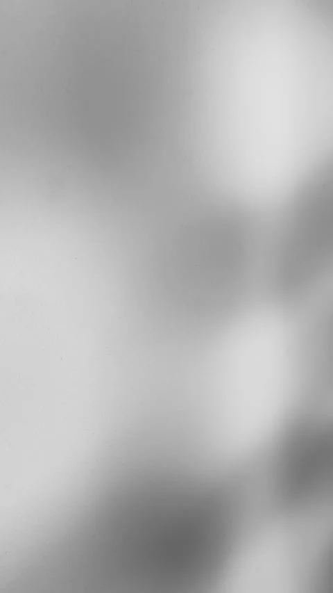 Subtle light interplay soft shadow dances across a smooth surface, casting an 動画素材 318610724