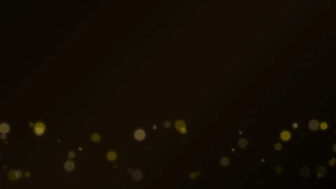 A subtle line of golden bokeh lights glowing against a deep black background Video stock 338310922