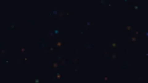 Subtle red and blue bokeh light particles floating on a deep black background Video stock 335117256