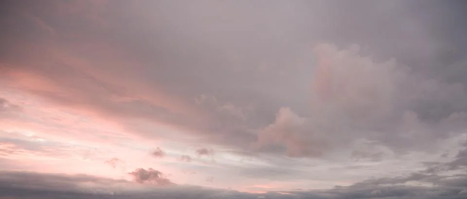 Subtle Sunset Sky: Pastel Clouds Stock Photos