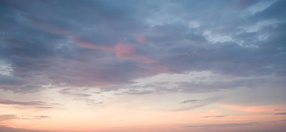 Subtle Sunset Sky: Pastel Clouds Stock Photos