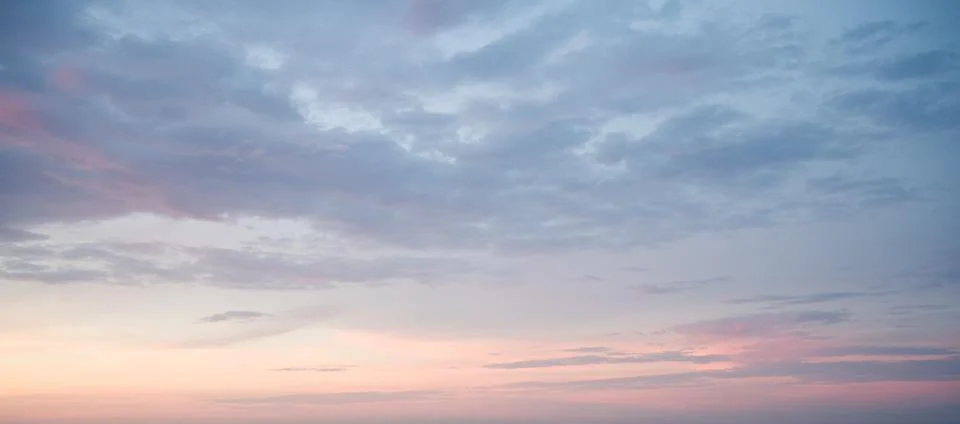Subtle Sunset Sky: Pastel Clouds Stock Photos