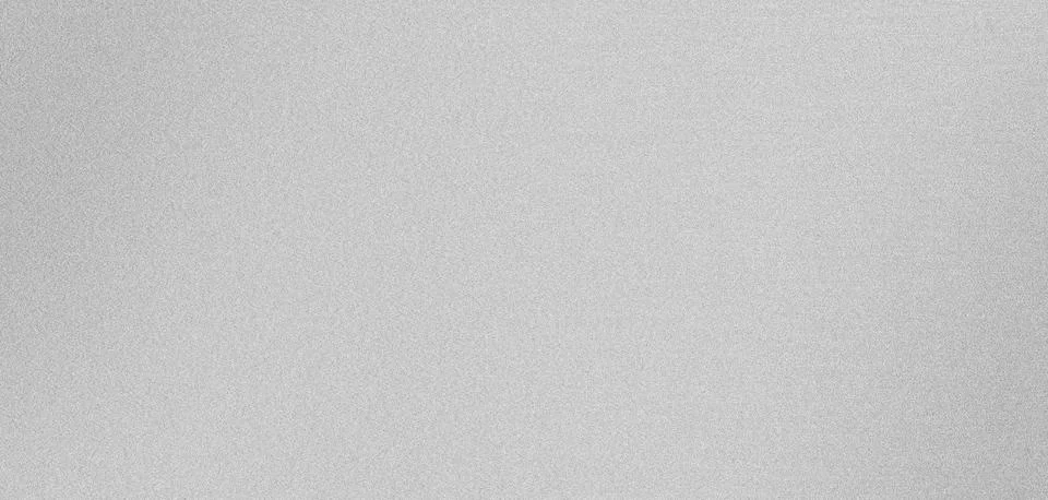 Subtle textured effect created by a grainy silver background 스톡 사진