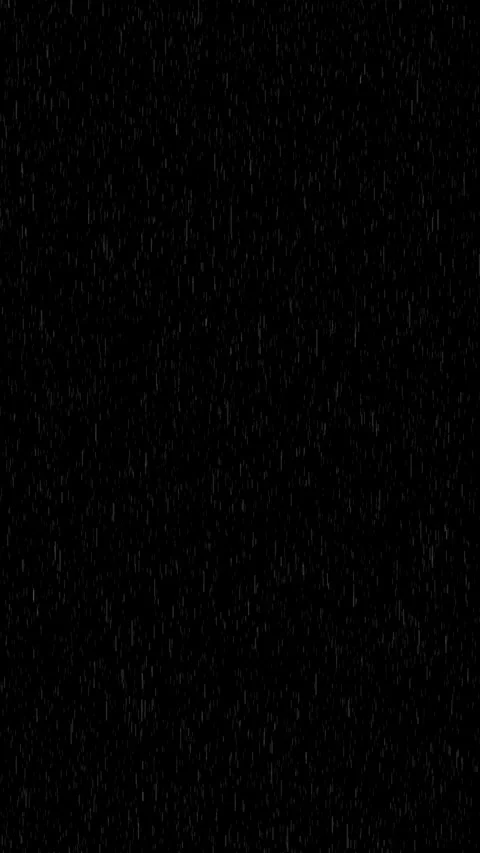 Subtle vertical rain streaks fall across a deep black background, creating .. Stock Footage 337155556