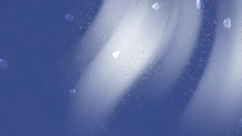 Subtle water droplets on a cool blue surface. Stock Photos