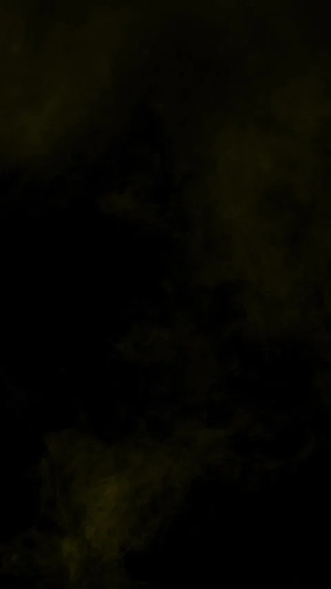 Subtle yellow smoke wisps for a minimal overlay, vertical format Stock Footage 340131450