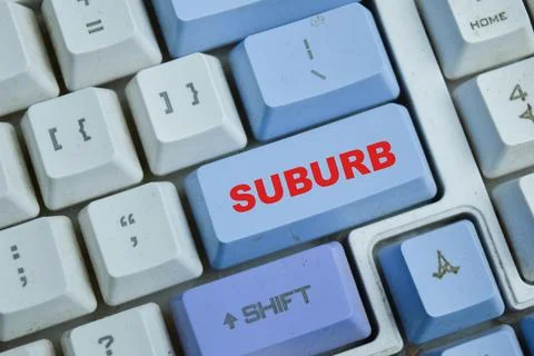 Suburb on the button keyboard. An outlying district of a city Stock Photos