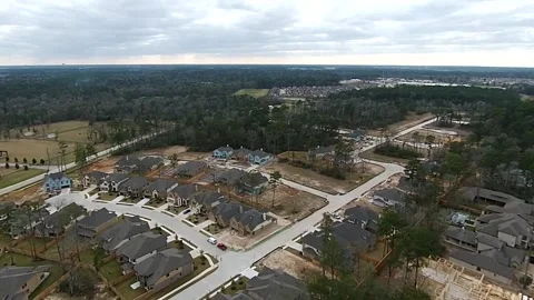 Suburban Development Aerial View of Growing Suburb with New Homes and Roads Vidéo 348218116