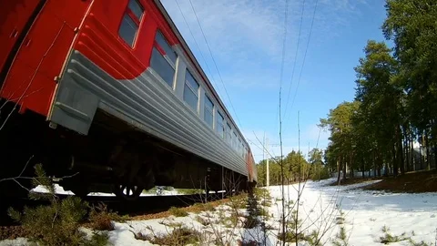 Suburban electric train moves towards on railroad turn against skyline Stock Footage 73653153