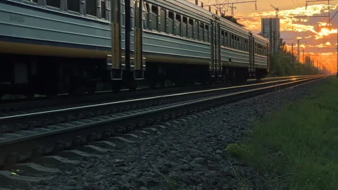 Suburban Electric Train Passing by at Golden Sunset in Summer | Railway Scene Stock Footage 337273652
