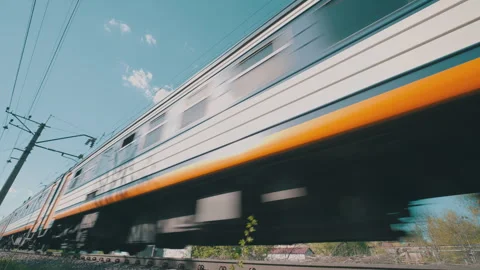 Suburban Electric Train Passing at High Speed: Low Angle Bottom-Up Close-Up Stock Footage 334059230