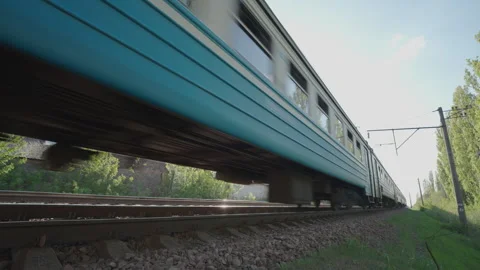 Suburban Electric Train Passing at High Speed: Low Angle Close-Up Side View Stock Footage 334059465