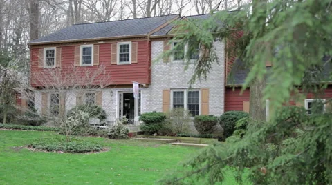 Suburban Home behind tree Stock Footage 46182136