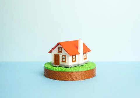 A suburban house on a plot of land. Figurines. Housing, buying and renting. B 写真素材