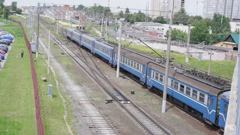 Suburban old soviet blue electrical locomotive with carriages travers on railway Video stock 147683783