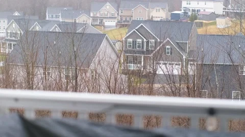 Suburban rainfall creates tranquil atmosphere in quiet neighborhood Video stock 302117839