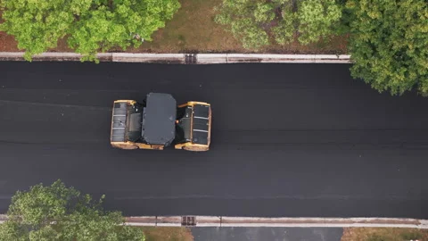 Suburban roadwork development new asphalt road. Aerial view Stock Footage 296086617