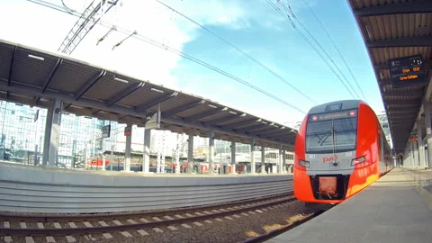 Suburban speed train leaves empty station summer Video stock 92998991