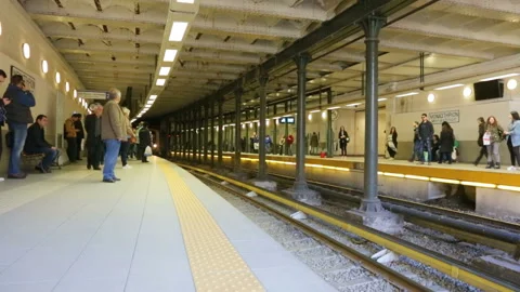 Suburban train coming to platform for boarding passengers Stock Footage 98466356
