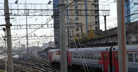 Suburban train rides to the station Stock Footage 56567269