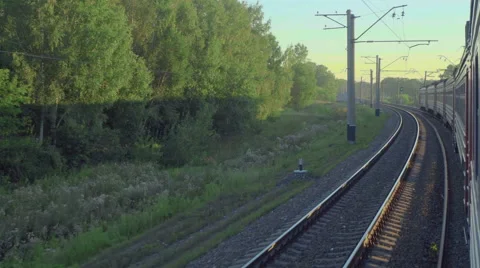 Suburban train at sunset Stock Footage