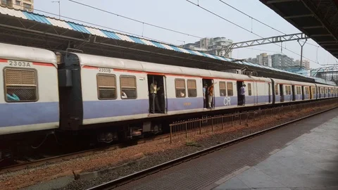 Suburban train at Tilaknagar station. Stock Footage 121351650